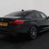 Photo 2 of 43 of WBAJB91010G463402 BMW 5 Serie M550i xDrive High Executive 4-drs Sedan